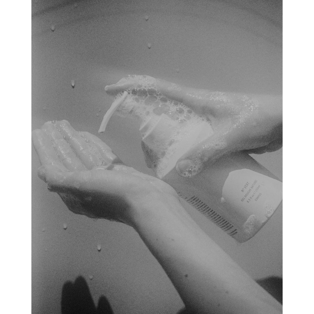 Model's sudsy hands pumping GoGreen body wash 