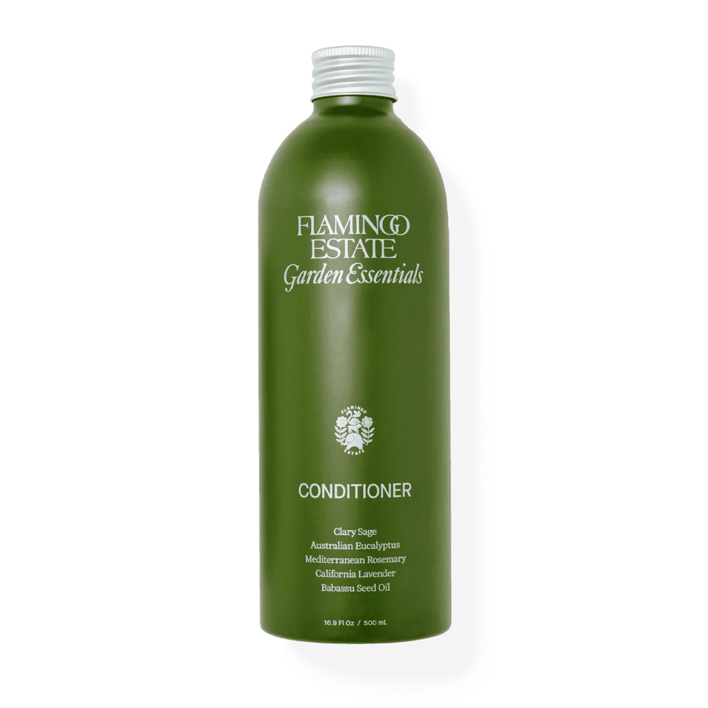Green bottle of flamingo estate garden essentials conditioner with various plant extracts.