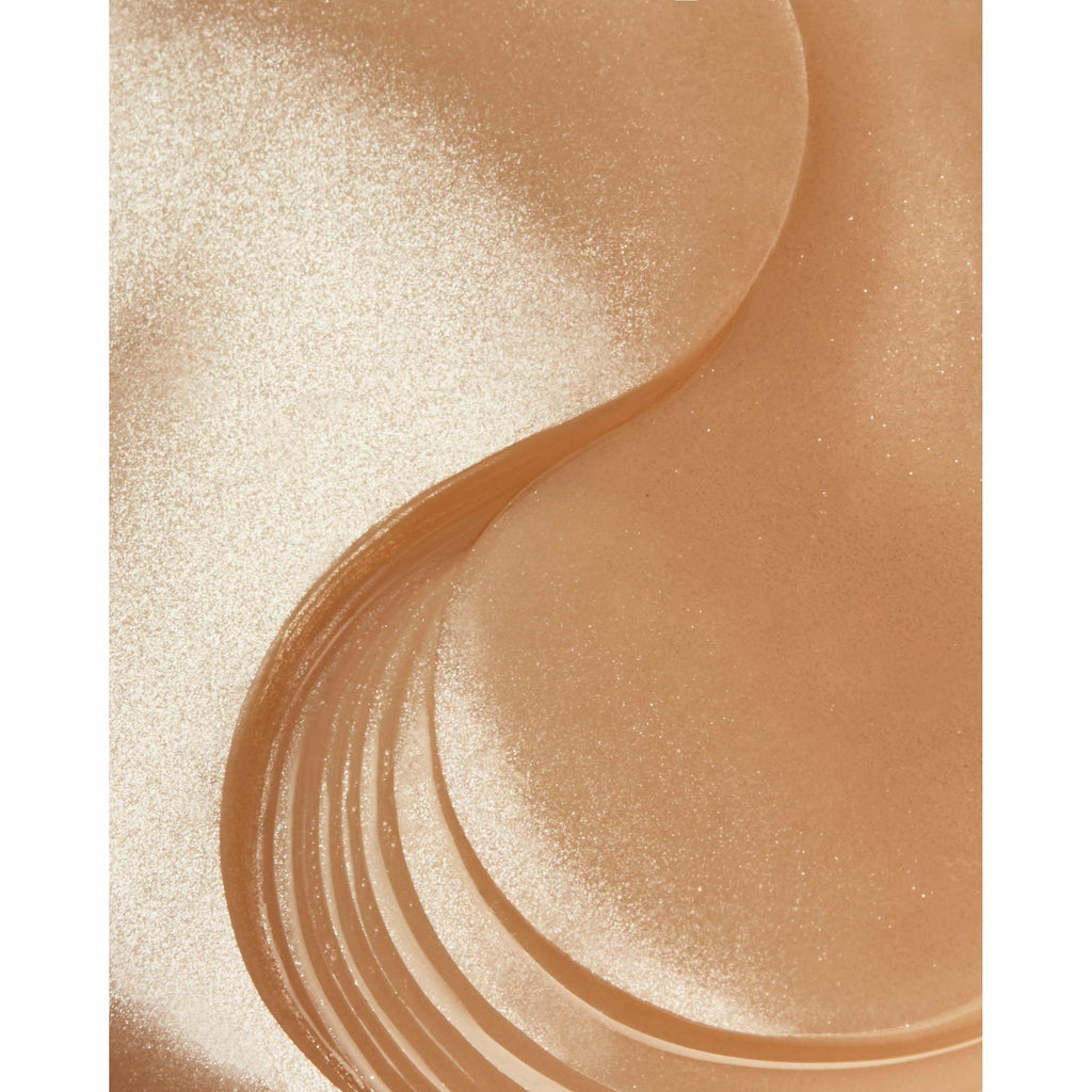 Close-up of swirled liquid foundation with a shimmering texture.