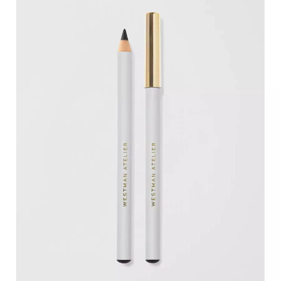 A white eyeliner pencil with its cap placed to the side on a light background.