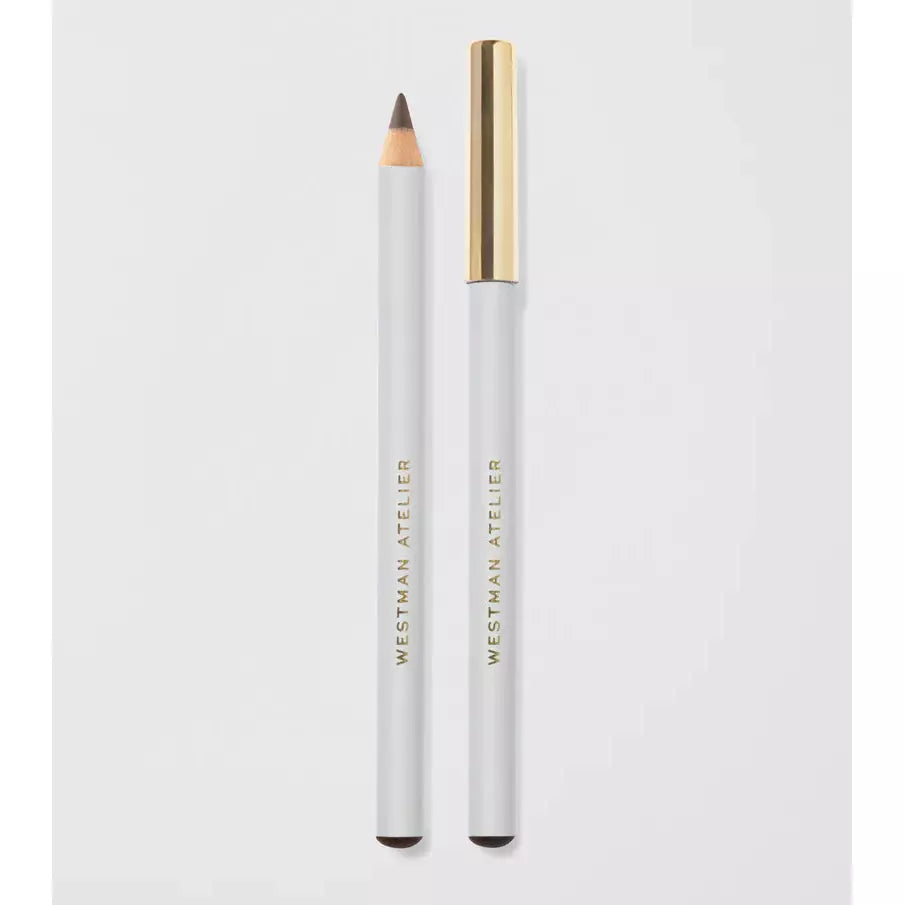 A white pencil eyeliner with a gold cap, displayed against a pale background.