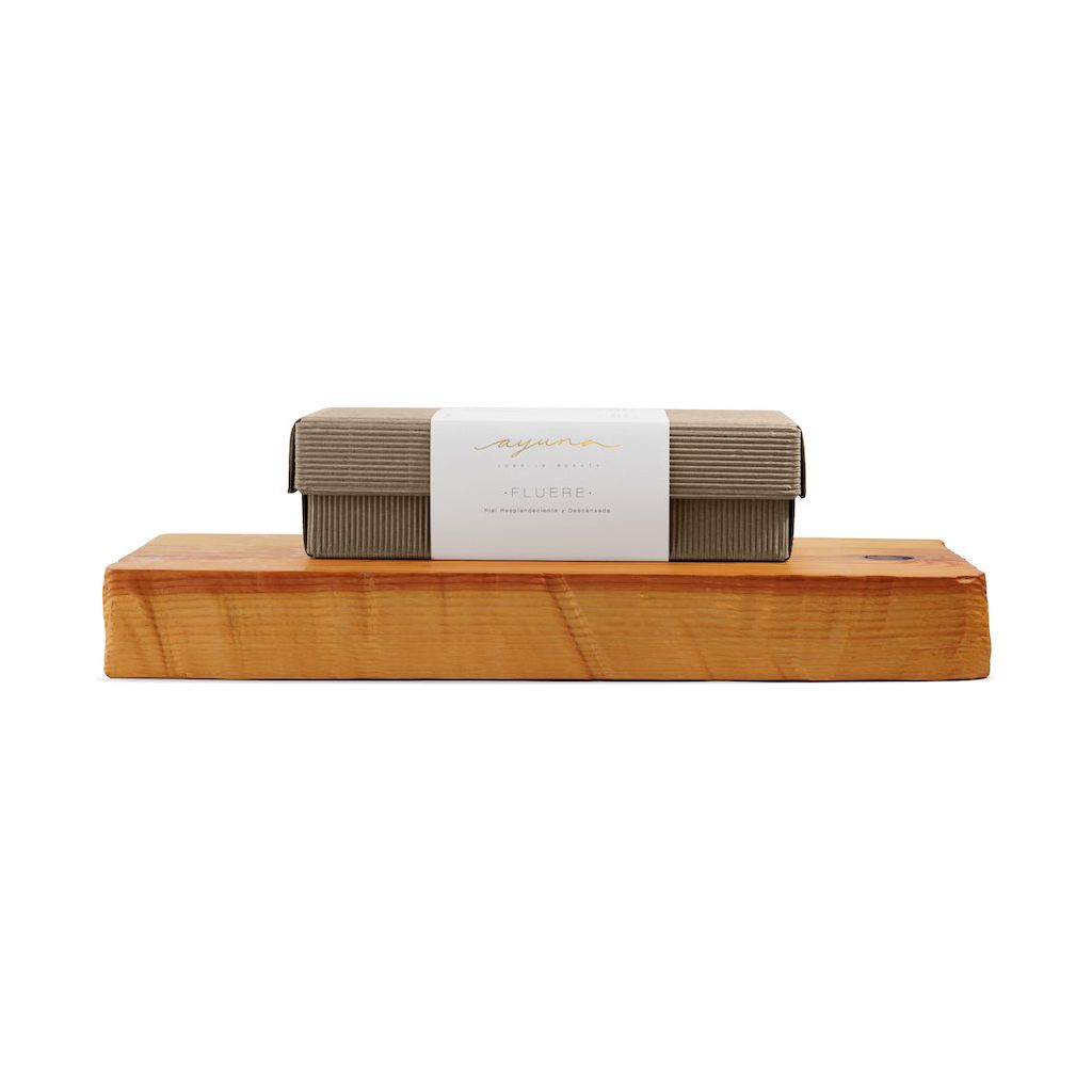 Eco-friendly soap bars on a wooden holder with minimalist branding.