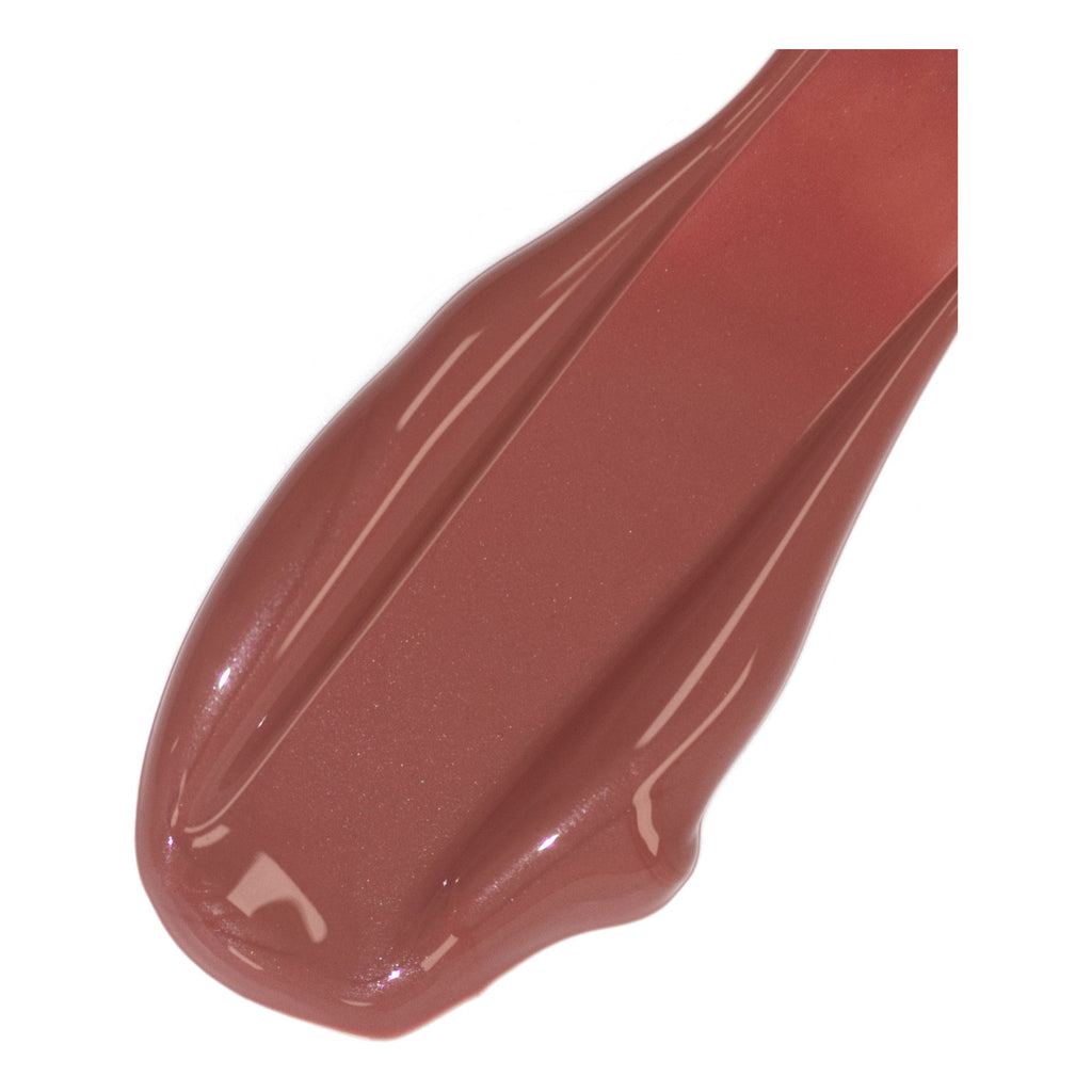 A swatch of glossy brown lipstick shade.