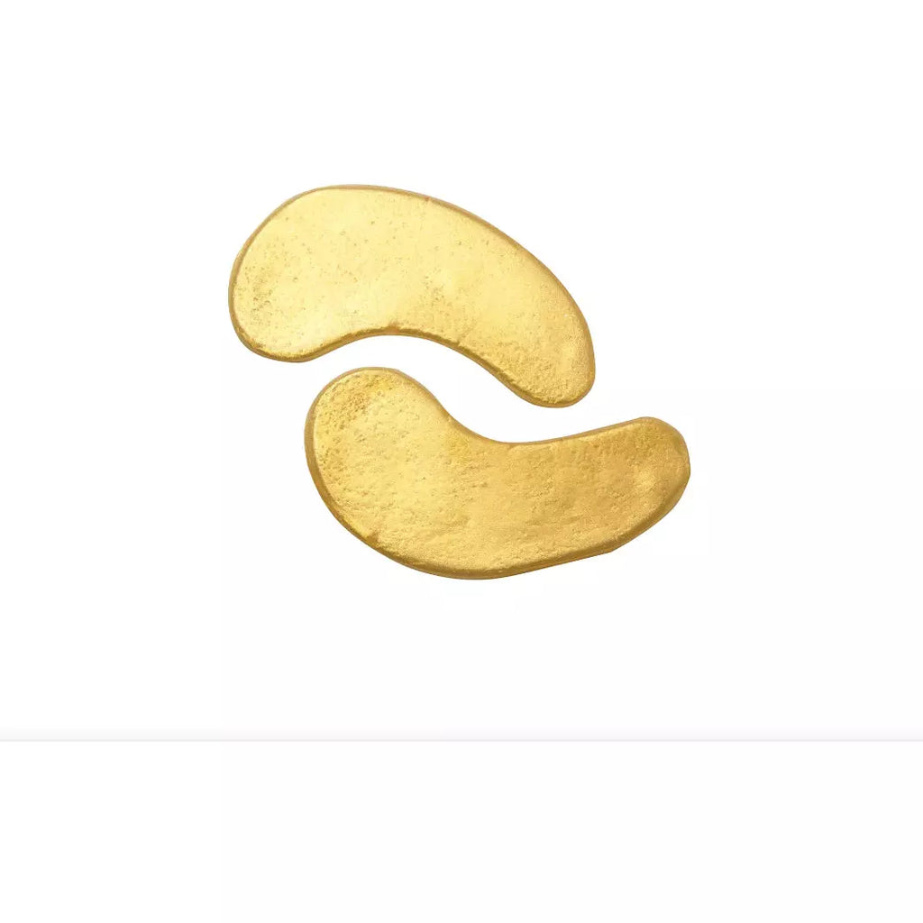 Two golden-painted potato chips on a white background.