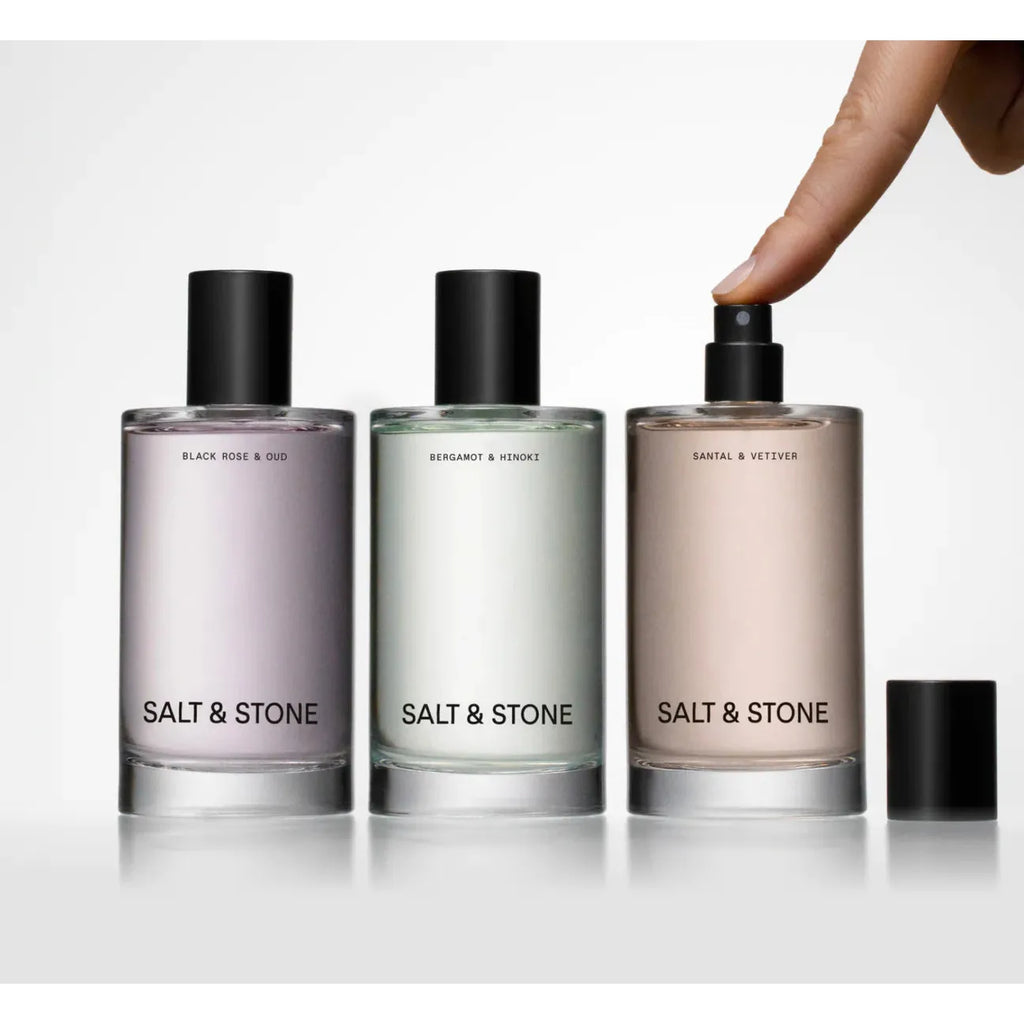 Salt & Stone Body Mist Collection + Woman spraying Santal & Vetiver