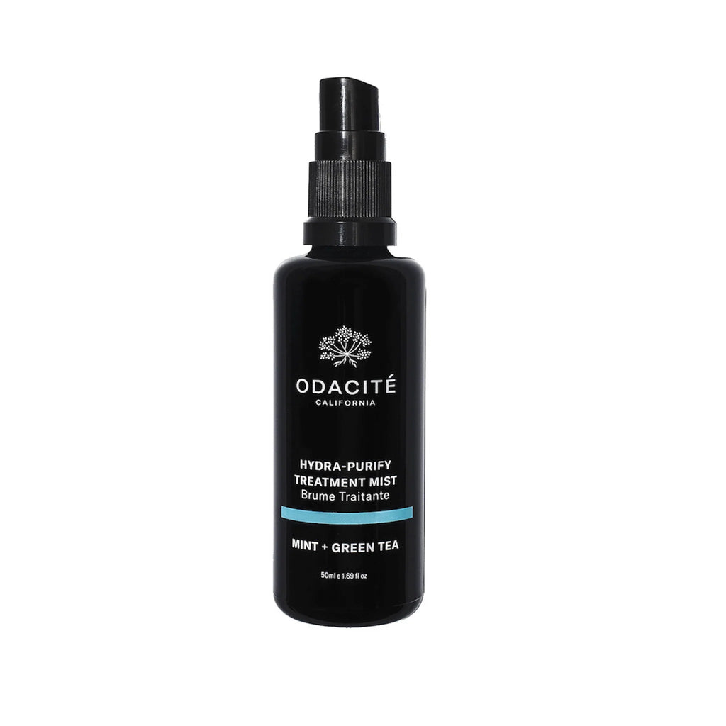 A bottle of odacite hydra-purify treatment mist with mint and green tea.