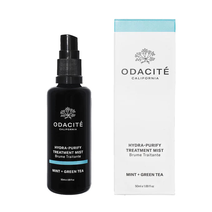 Odacite california hydra-purify treatment mist with mint and green tea in a black spray bottle next to its packaging box.
