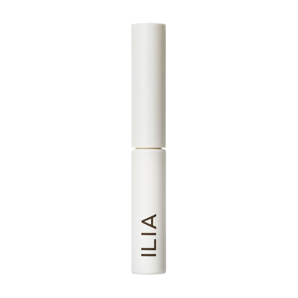 White ilia branded cosmetics tube against a white background.