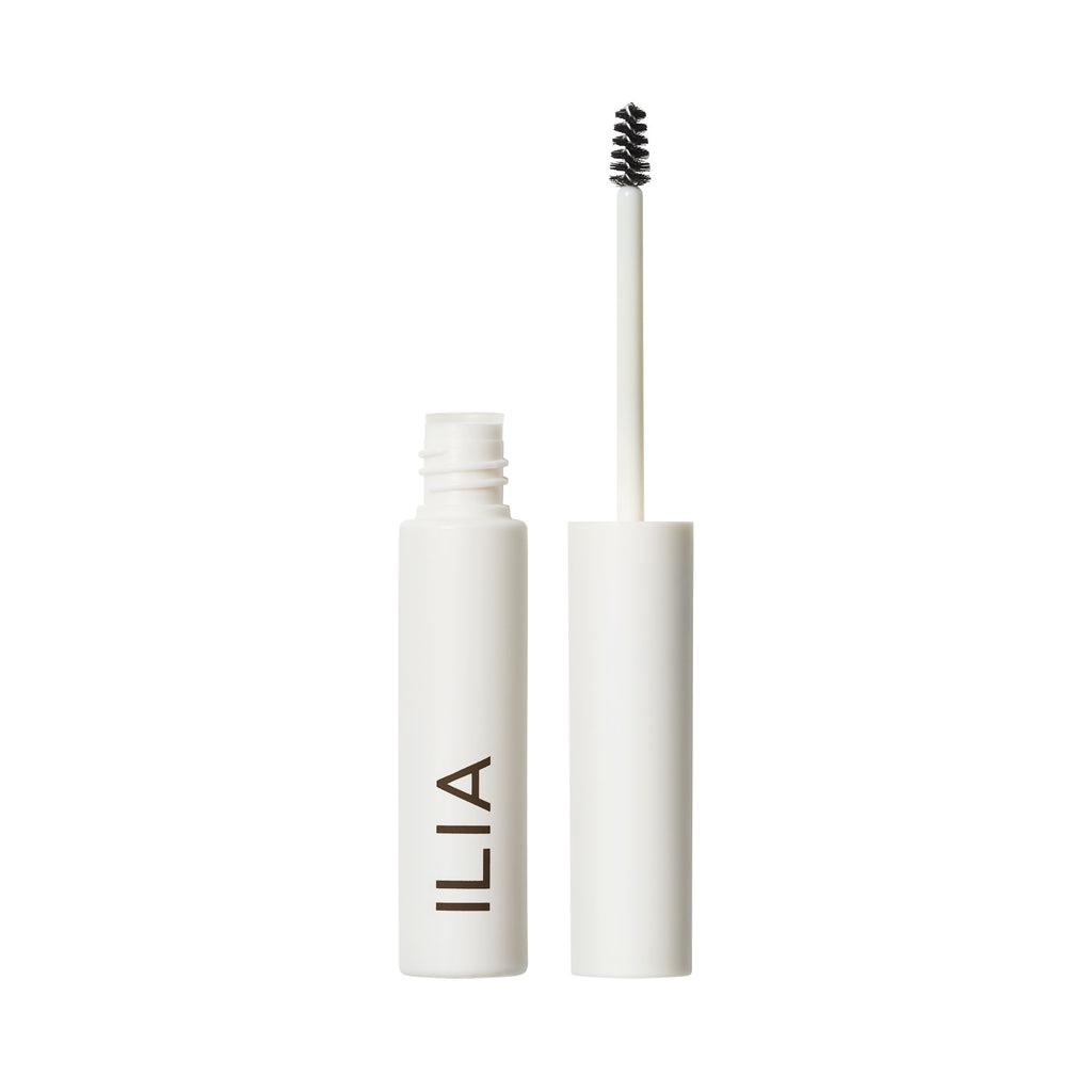 Open mascara tube with applicator brush displayed against a white background.