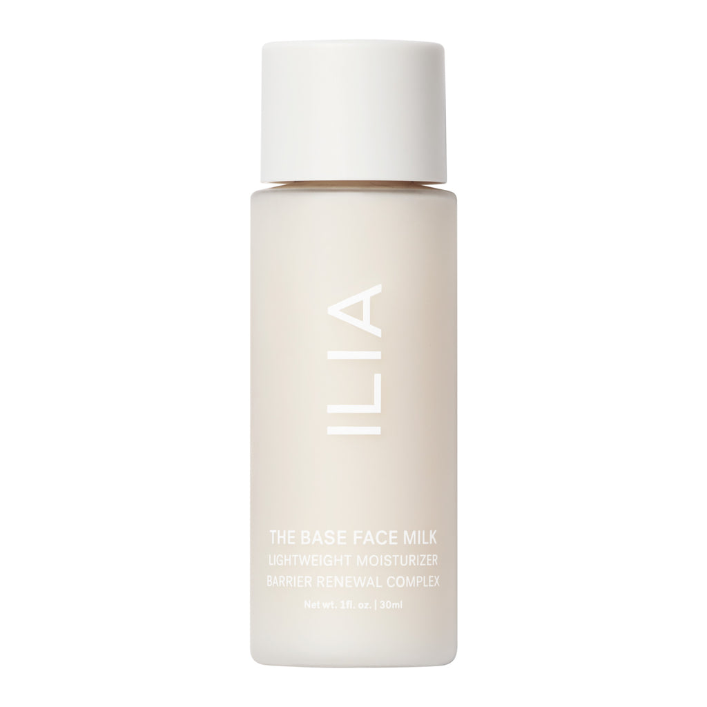 A bottle of ilia the base face milk lightweight moisturizer with barrier renewal complex, 30ml.
