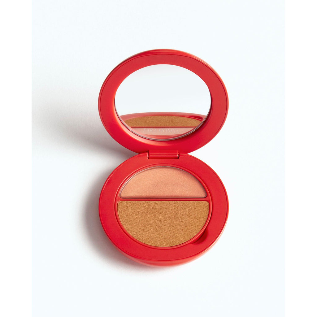A compact powder makeup palette with mirror, featuring two shades.