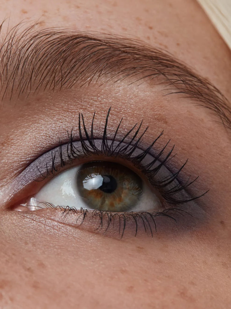 Model wearing LAVENDER GREY 05: In rich grey with smoky, lilac undertones in a silky matt texture, this shade is suitable as a daytime smokey eye variant for every eye color.