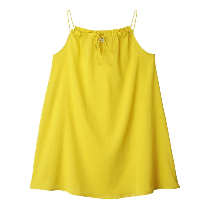 A Germaine des Prés Aurelia Yellow Nightie made from organic cotton nightie material features thin straps and a small adjustable neckline bow, shown against a white background.