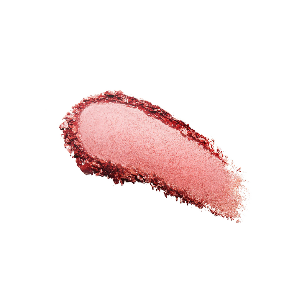 Smeared lipstick sample in a reddish shade on a white background.