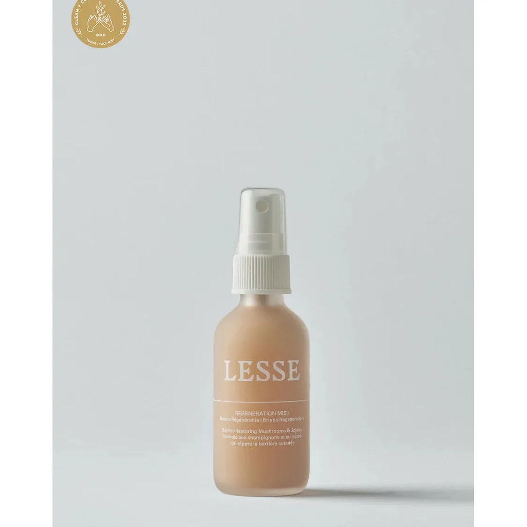 A spray bottle of lesse regeneration mist skincare product against a plain background.