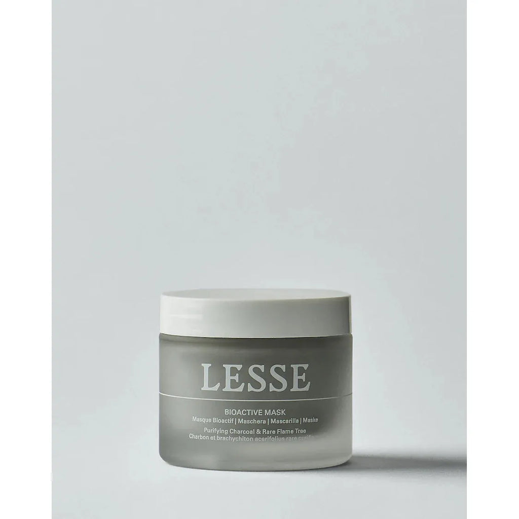 A jar of lesse bioactive face mask against a plain background.