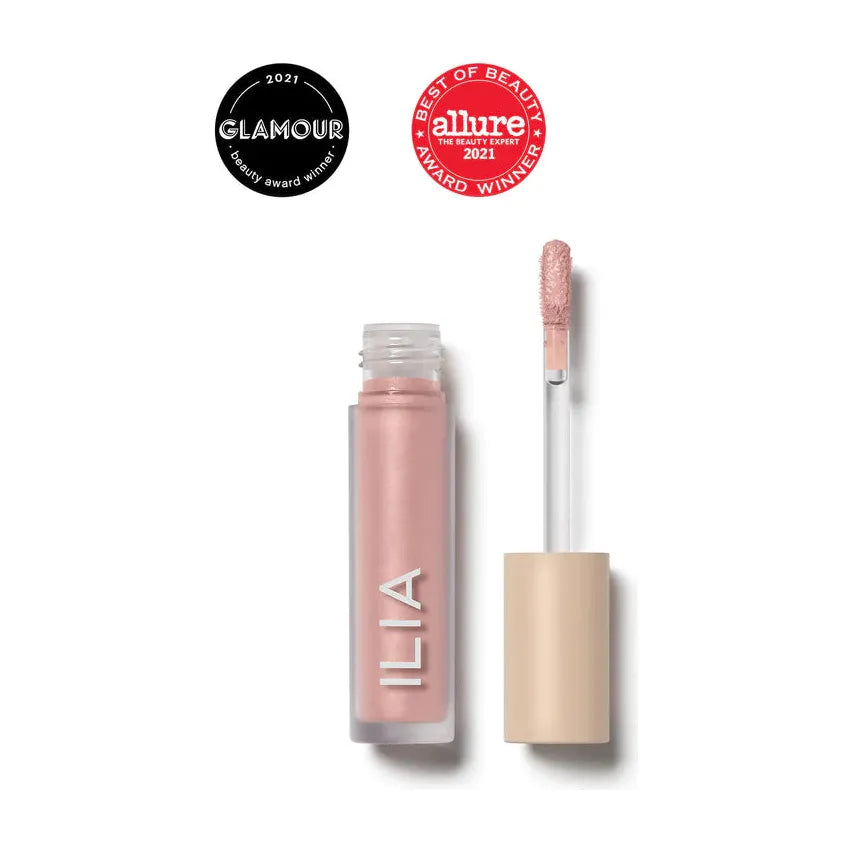 Tube of ilia lip gloss with applicator and two award badges from glamour and allure for best of beauty 2021.