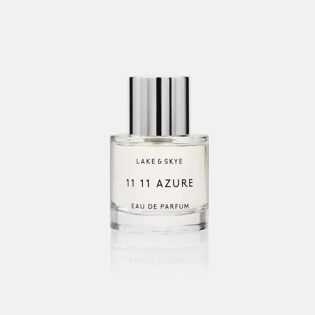 A bottle of lake & skye 11 11 azure eau de parfum on a white background.