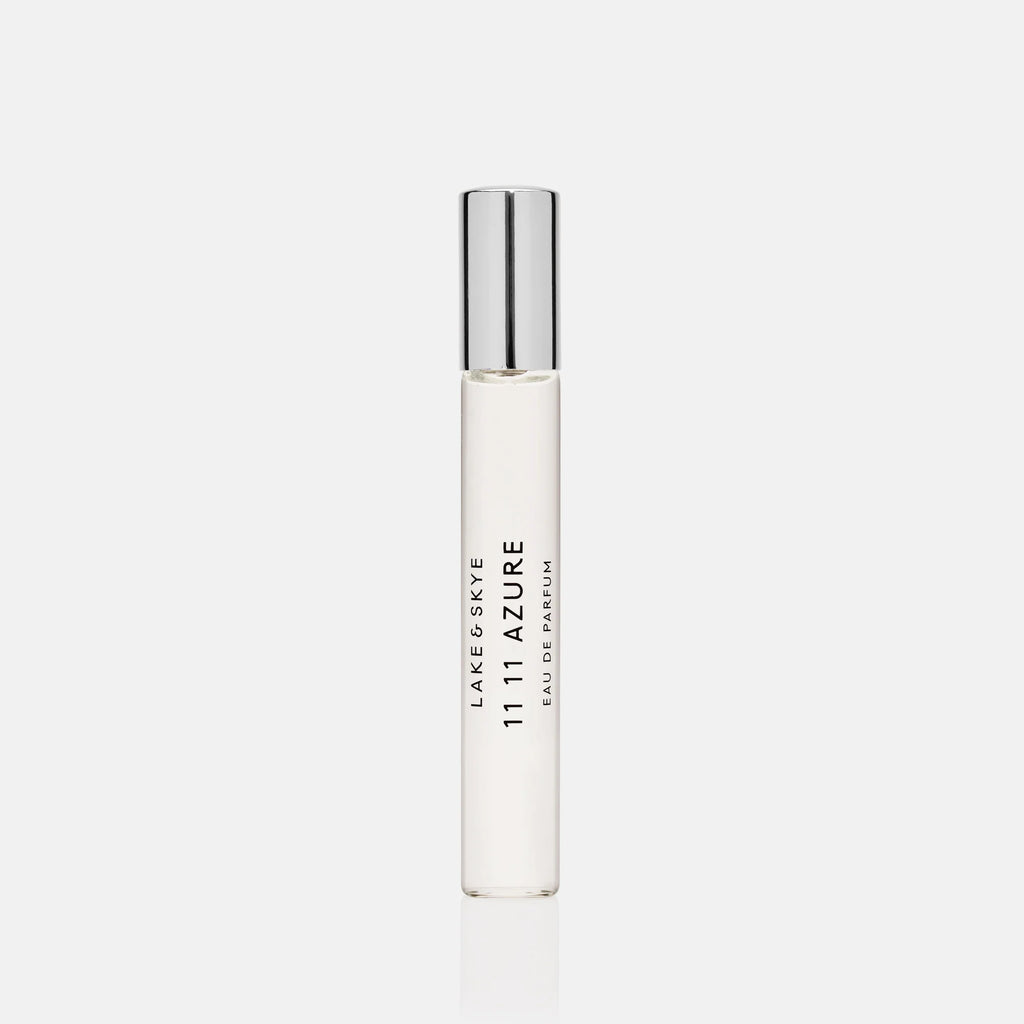 A sleek white and silver rollerball perfume bottle.