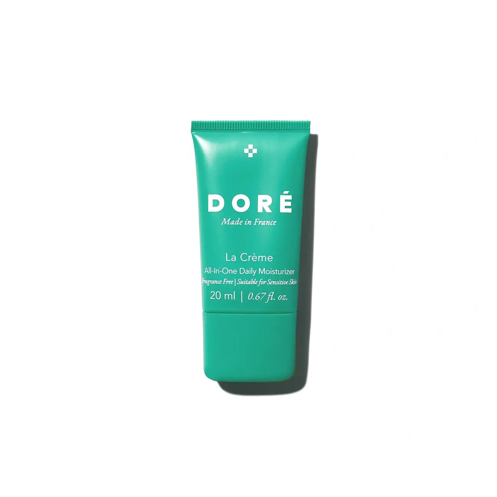 A tube of dore 'la creme' all-in-one daily moisturizer against a white background.