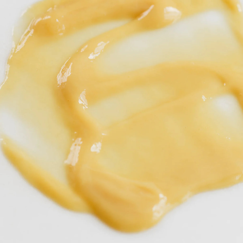 Close-up of a melted cheese slice on a white background.