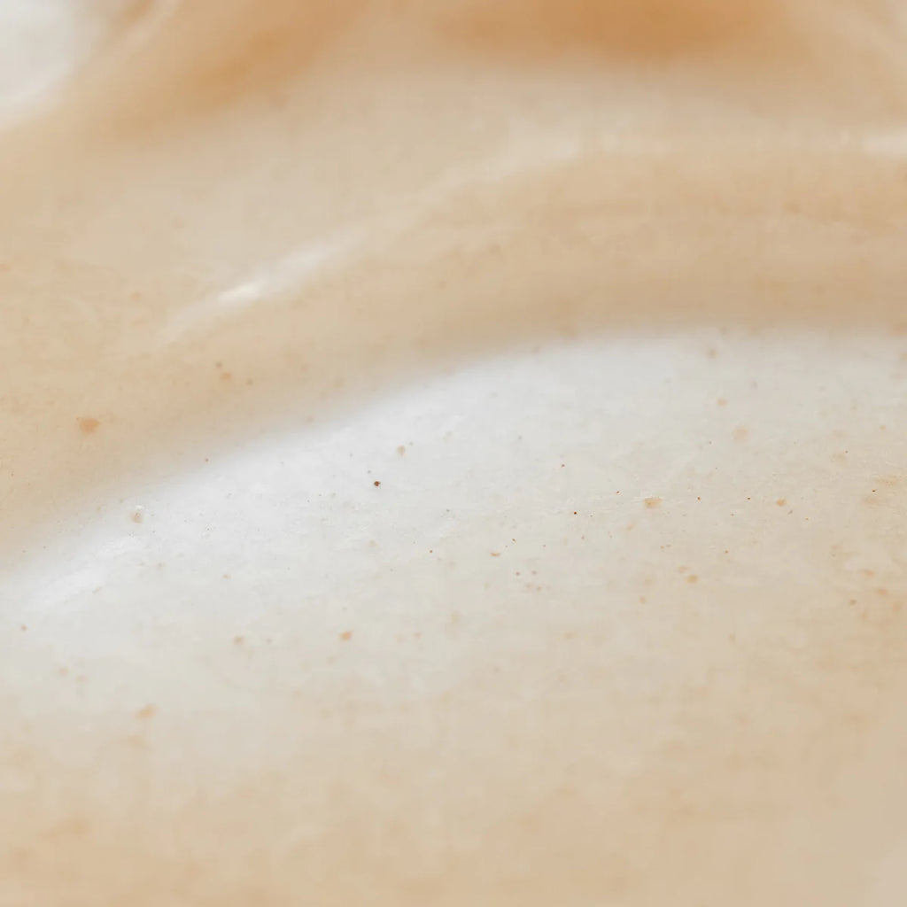 Close-up of a textured, creamy surface with tiny specks.