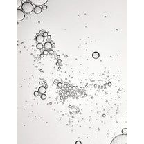 Floating bubbles forming a diagonal pattern against a pale background.