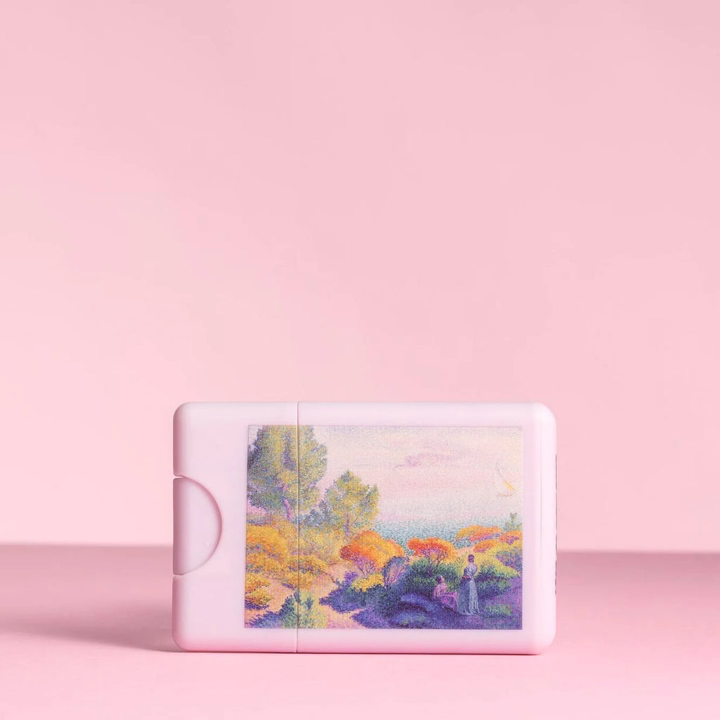 A digital device displaying a colorful landscape artwork on a pink background.