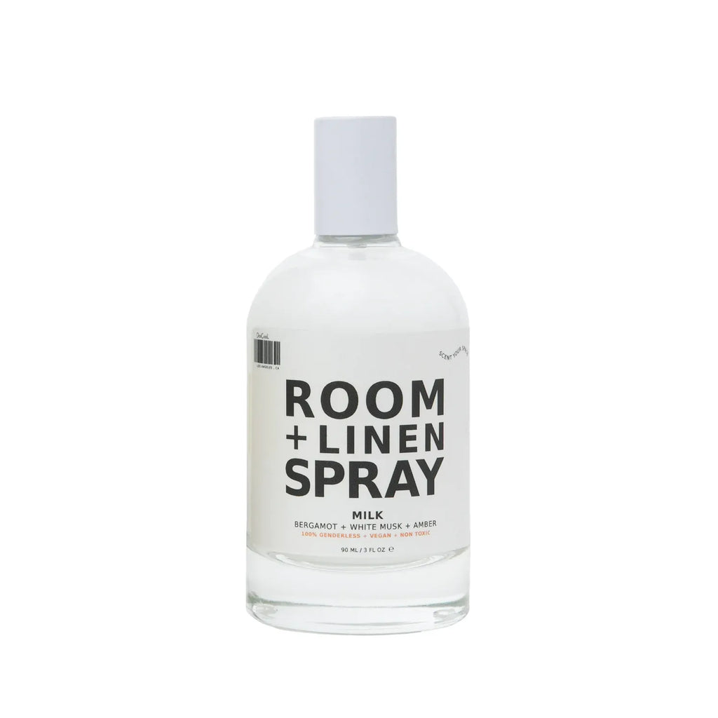 Bottle of room and linen spray against a white background.