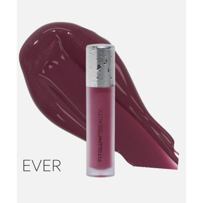 A swatch of glossy purple lip product next to a tube of lipstick with the label "fellow beauty.