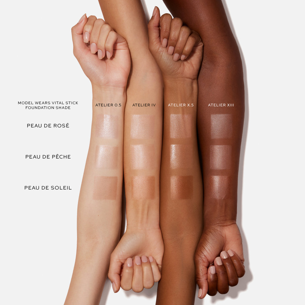 Four arms of varying skin tones displaying swatches of foundation shades.