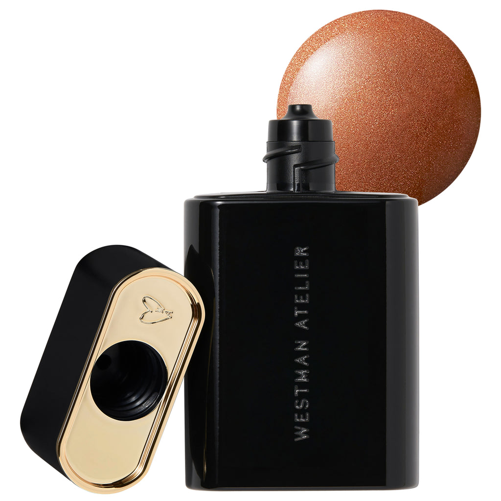 A bottle of westman atelier perfume with a bronze-colored spherical cap.