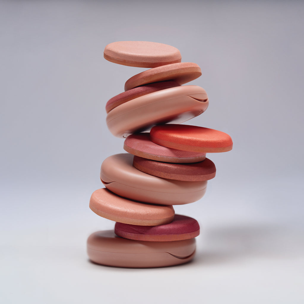 Shades Stacked in a cairn formation. Weightless color meets a soft-focus filter.