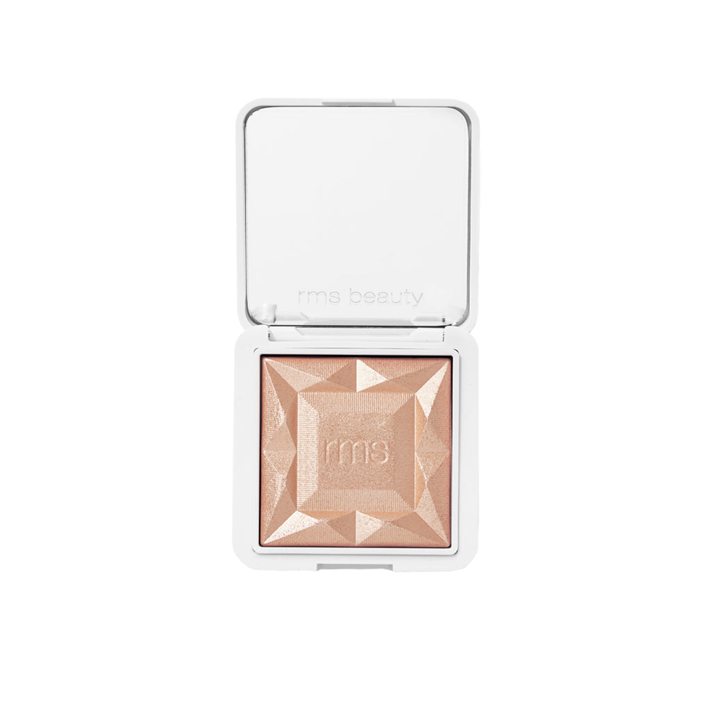 Compact powder highlighter with geometric embossment by rms beauty.