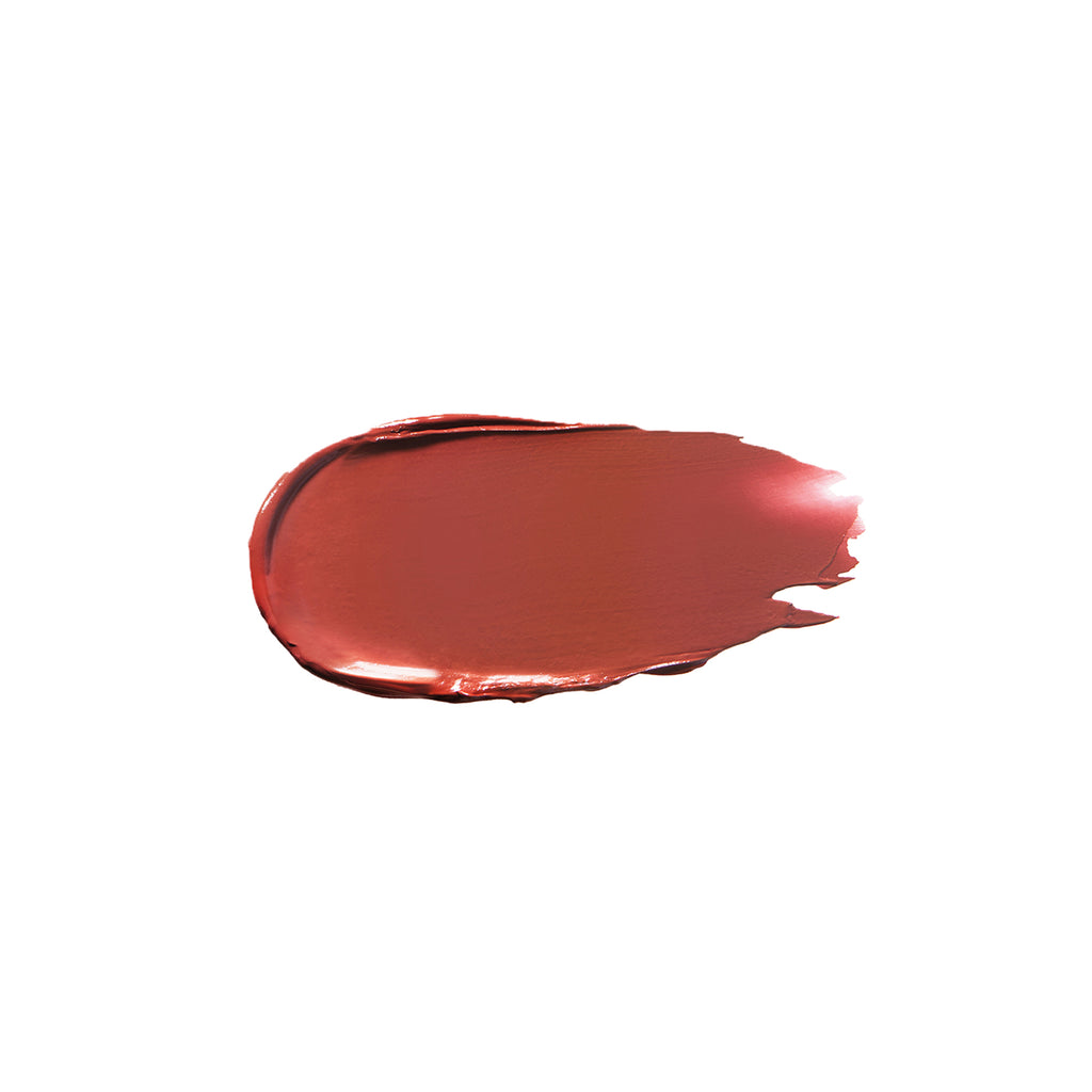 A smear of red lipstick on a plain background.