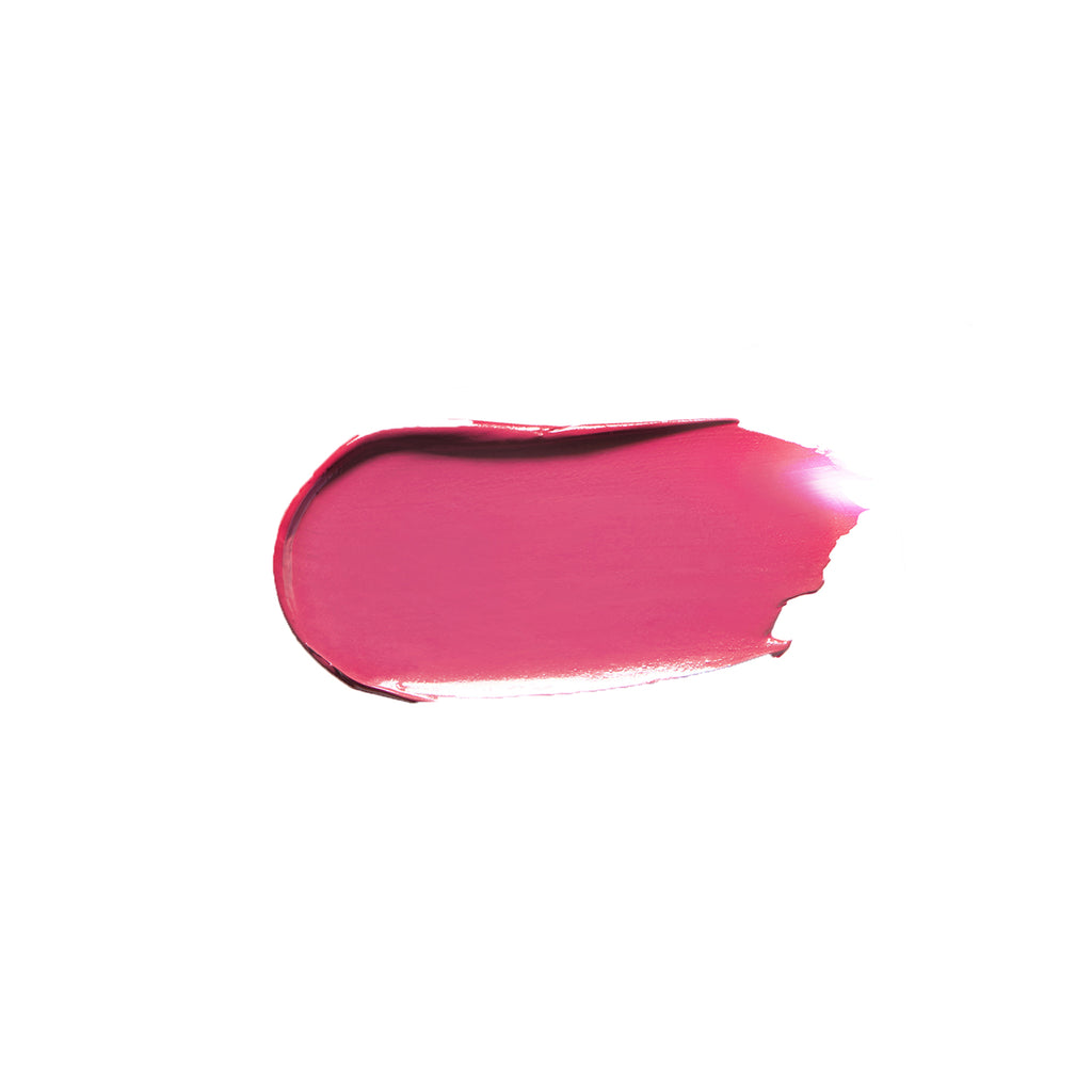 A smear of bright pink lipstick on a white background.