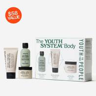 A set of the Youth to the People The Youth System Body Care Kit, featuring a dual-action body exfoliant and ultra-luxe body butter, alongside a refillable antioxidant body wash. The four items are neatly arranged next to a box with product images and descriptions. A red circle in the top left corner displays "$58 VALUE.