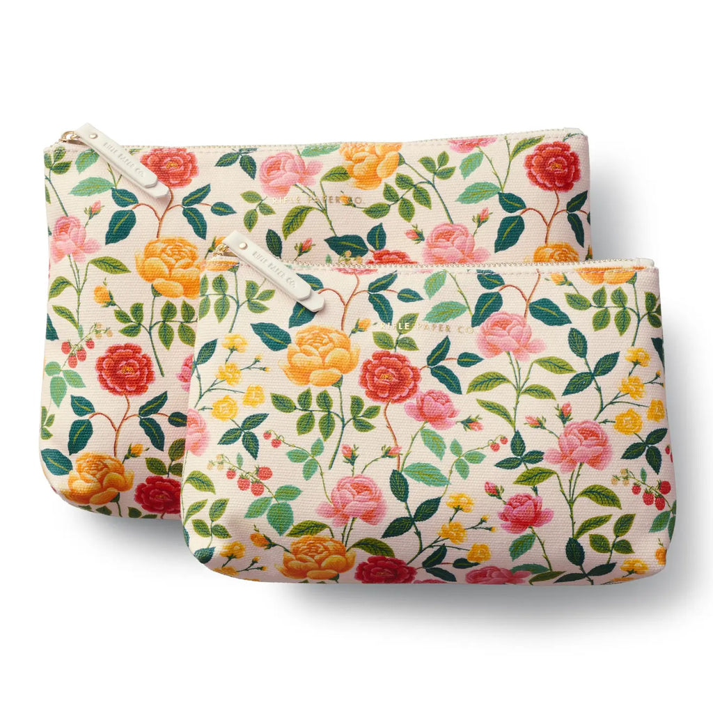 Two floral-patterned fabric pouches with zippers.