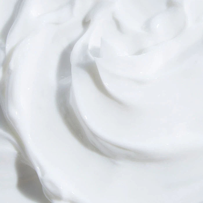 Close-up of white cream with a swirled texture.