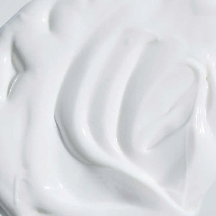 Close-up of a smooth white cream texture.