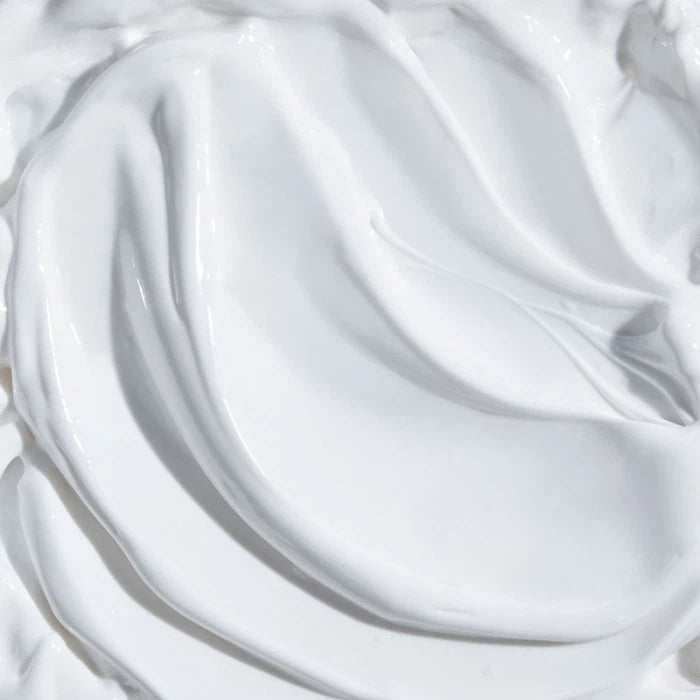 Swirling texture of white cream or cosmetic product.