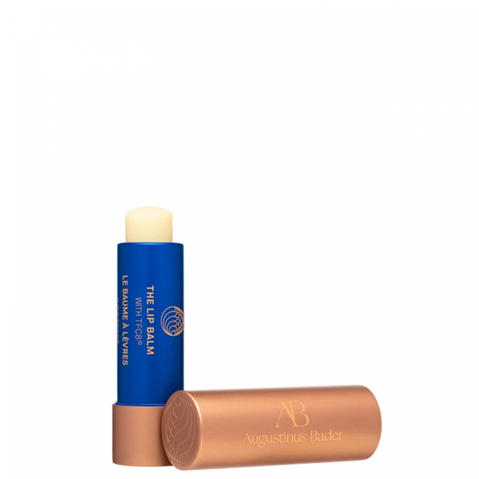 Product image of augustinus bader the lip balm against a black background.