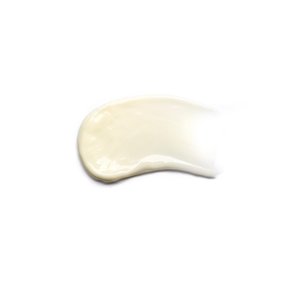 A dollop of white cream isolated on a white background.