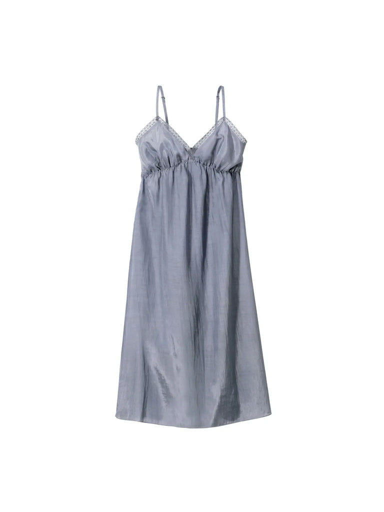 The Germaine des Prés Josephine Grey Nightie is an ultra-feminine piece featuring a sleeveless design, silver-grey satin fabric, spaghetti straps, and delicate lace trim around the neckline, exuding elegance.