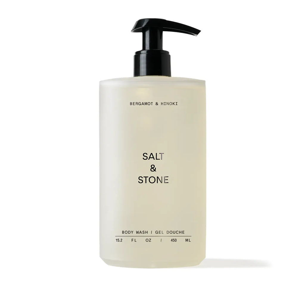 A pump bottle of salt & stone body wash against a white background.