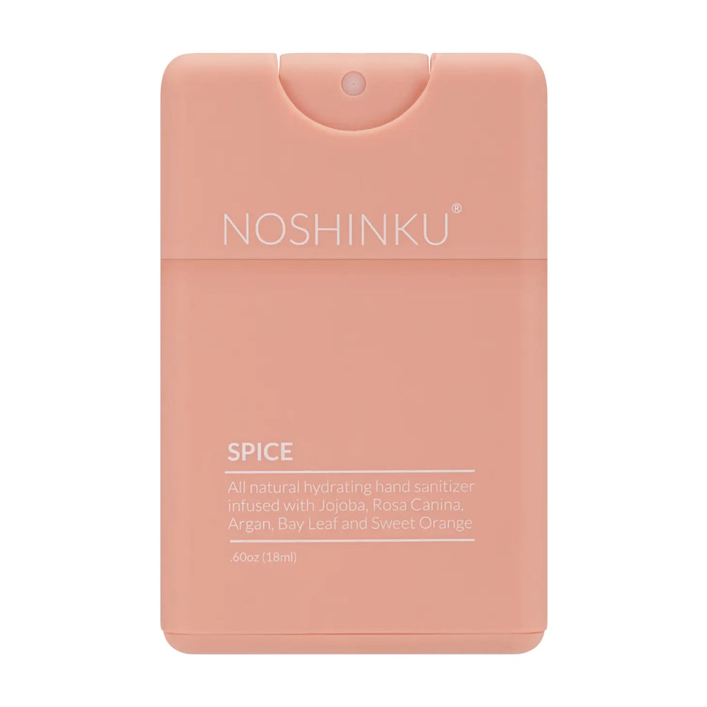 A pink, credit card-shaped bottle of noshinku hand sanitizer with natural ingredients listed on the label.