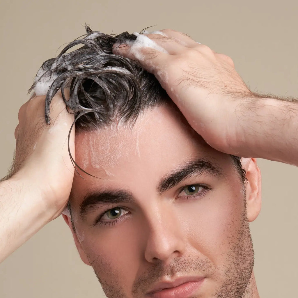 Man shampooing his hair.