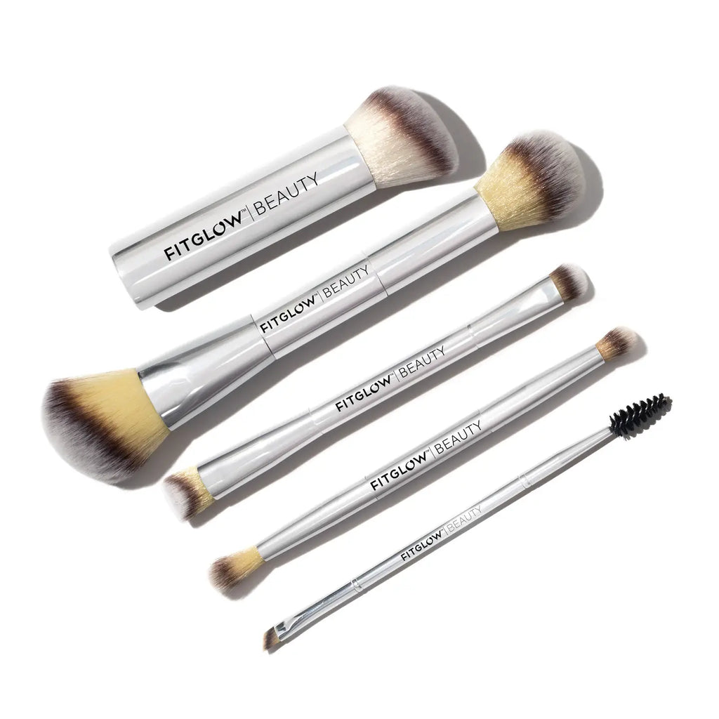 A set of five cruelty-free brushes with silver handles arranged on a white background, from the Fitglow Beauty Master Brush Set.