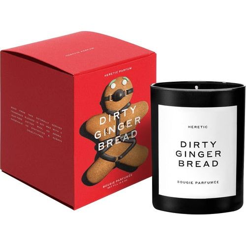 Scented candle labeled "dirty gingerbread" by heretic parfum, presented next to its red packaging box.