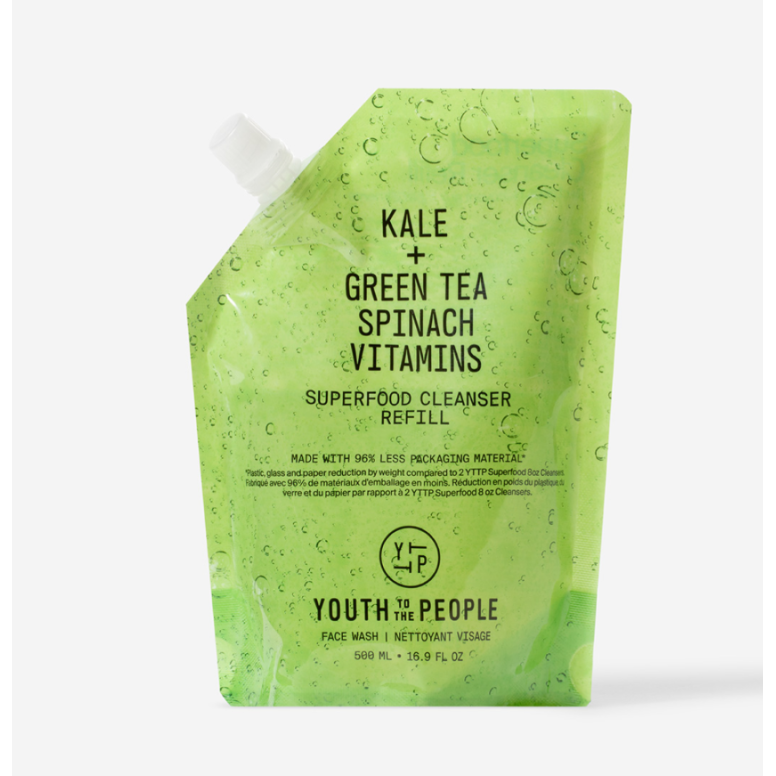 Green kale, green tea, and spinach vitamin superfood cleanser packaging with droplets of water.